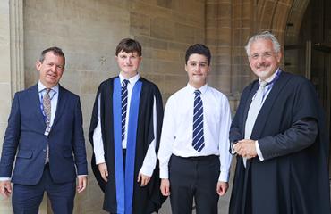 Chris C and Isaac H with the Head of History and the Head Master